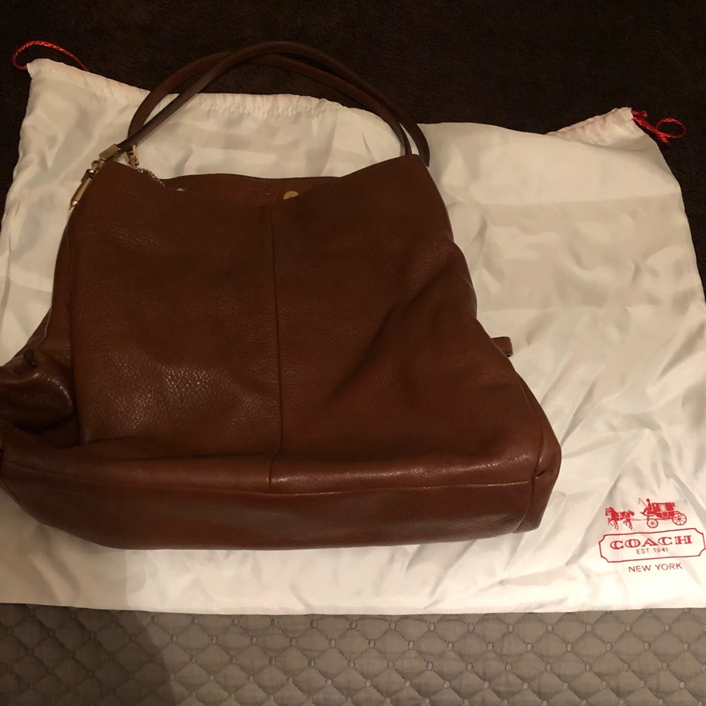 Authentic 3 pocket brown leather coach purse.